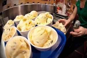 Manager Sara Brummel scoops dishes of chocolate chip cookie dough ice cream at the Babcock Dairy Store at the University of Wisconsin-Madison on March 17, 2010. Brummel was preparing several trays of ice cream ordered for school children who would soon to take a tour of the Babcock Dairy Plant. ©UW-Madison University Communications 608/262-0067 Photo by: Jeff Miller Date: 03/10 File#: NIKON D3 digital frame 6583