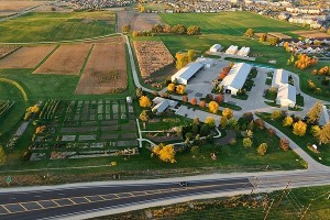 The West Madison Agricultural Research Station is pictured in an aerial view of the University of Wisconsin-Madison campus during an autumn sunset on Oct. 5, 2011 In the foreground is Mineral Point Road. The photograph was made from a helicopter looking north. (Photo by Jeff Miller/UW-Madison)