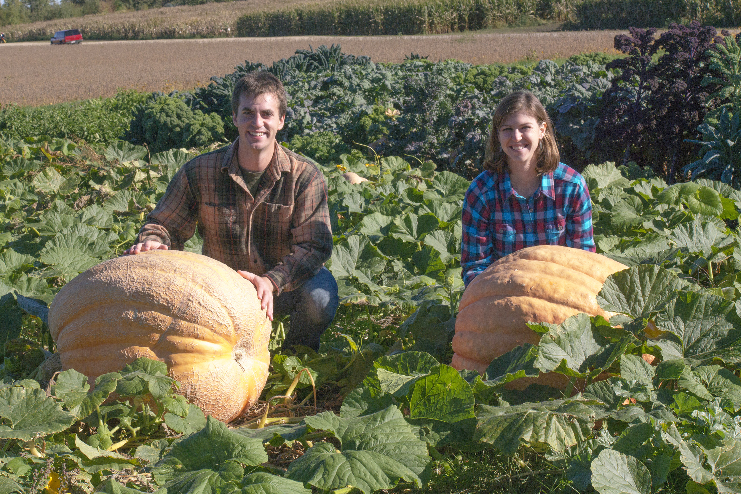 Chris D’Angelo and Lynn Maher with the Giant Atlantic pumpkins they helped grow for the Giant Pumpkin Regatta.