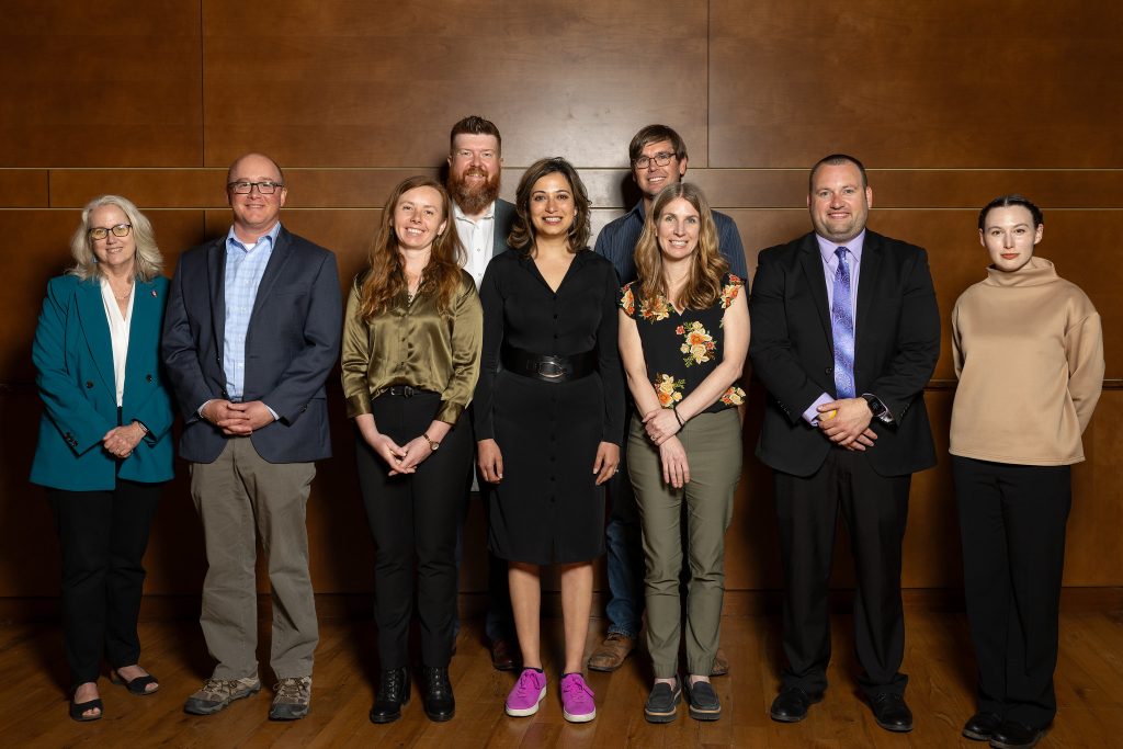 Group photo of nine people