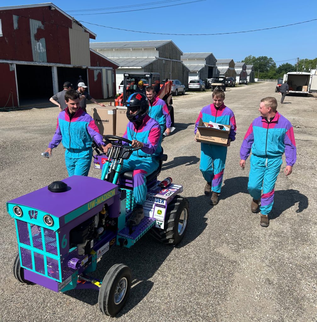 men walking with tractor