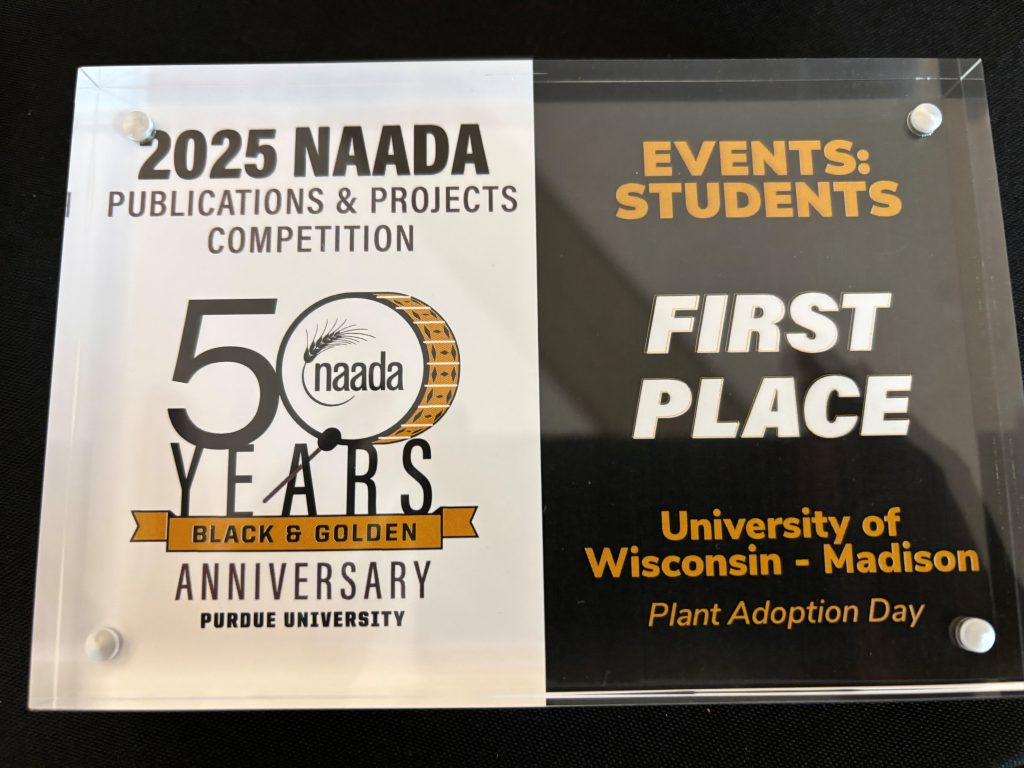 Award with left half white, right half clear and black and gold text